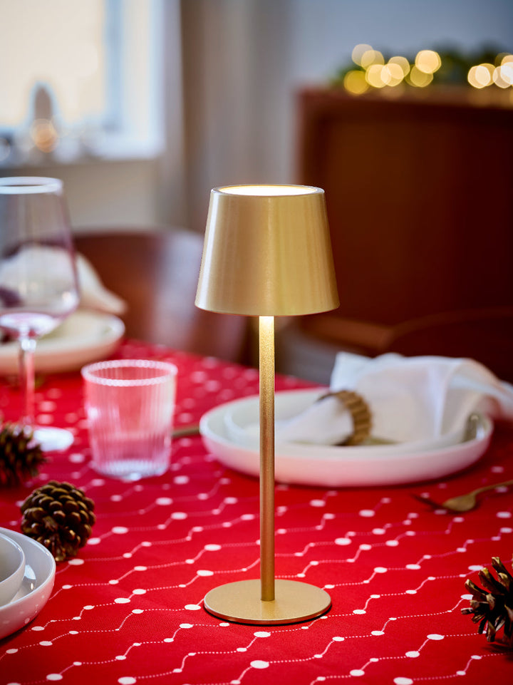 La lampe de table dorée